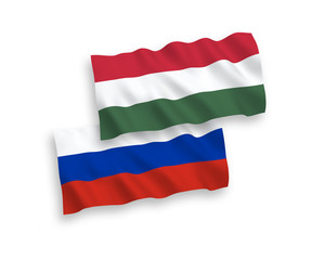 National vector fabric wave flags of Hungary and Russia isolated on white background. 1 to 2 proportion.