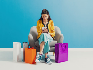 Young woman checking fashion shopping sales online