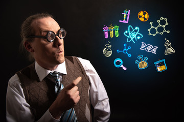 Funny scientist looking to chemistry symbols chemical