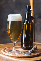Glass beer on dark background with copy space