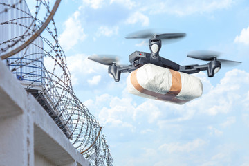 The drone flew across the sky with smuggling. The drone transports forbidden goods across the...