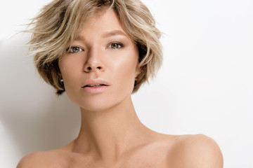 Beautiful young woman model with light color hair. Beauty portrait with clean skin and nude makeup....