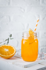 Fresh summer orenge cocktail in glasses on white background