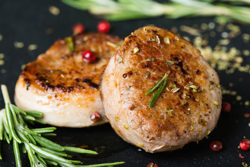 Fried pork tenderloin medallions with spices and herbs