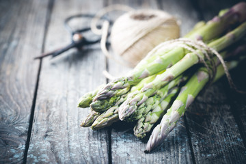 Bunch of fresh asparagus on wooden table