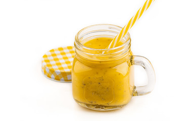 Smoothie with tropical fruits: mango, banana, avocado, chia seeds in a glass jar