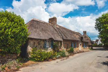 Village of Kerascoet, traditional stone houses with thatched roof in Brittany France.A beautiful...