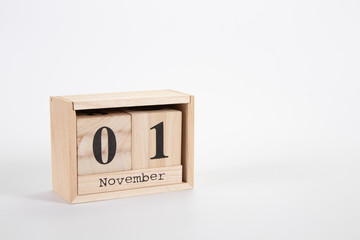 Wooden calendar November 01 on a white background