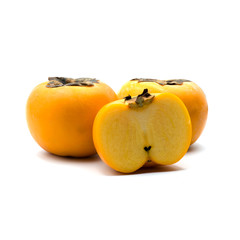 Ripe persimmon isolated on the white background.