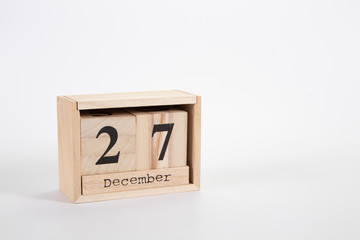 Wooden calendar December 27 on a white background