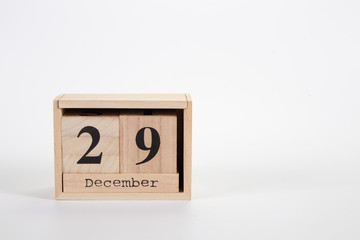 Wooden calendar December 29 on a white background