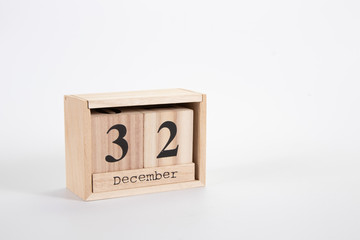Wooden calendar December 32 on a white background