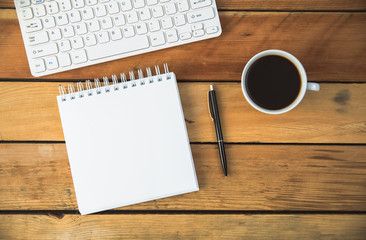 notepad with coffee and computer