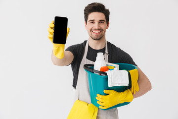 Handsome brunette houseman wearing apron