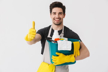 Handsome brunette houseman wearing apron