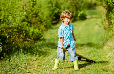 summer activity. small kid gardener having fun. human and nature. farming and agriculture cultivation. happy child farmer play with garden shovel, spring. earth day. Eco life. Enjoying spring wind