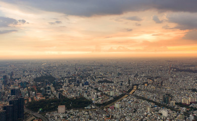 Top View of Building in a City - Aerial view Skyscrapers flying by drone of Ho Chi Mi City with development buildings, transportation, energy power infrastructure.
