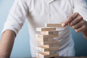 man hand wooden cubes