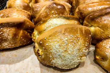 Shelf with pastries in the shop, buns, food background.