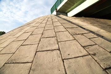 View of reinforced concrete slabs slope road bridge. Construction, technology.