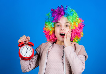 Kid colorful curly wig clown style hold alarm clock. I am not joking about discipline. False alarm....