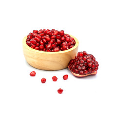 Pomegranate In a wooden cup isolated on the white background.