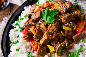 Tajin beef stew with rice paprika and sesame seeds