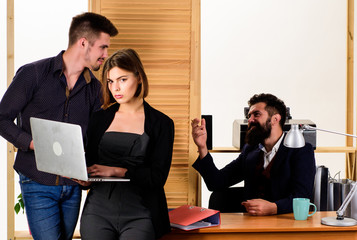 Woman working in mostly male workplace. Woman attractive lady working with men. Office collective...