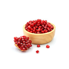 Pomegranate In a wooden cup isolated on the white background.
