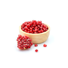 Pomegranate In a wooden cup isolated on the white background.