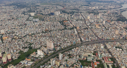 Top View of Building in a City - Aerial view Skyscrapers flying by drone of Ho Chi Mi City with development buildings, transportation, energy power infrastructure.