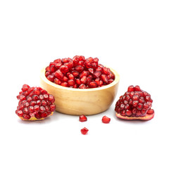 Pomegranate In a wooden cup isolated on the white background.