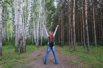 A woman in the woods.