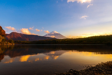 Fototapeta na wymiar Twilight scenery of lake Saiko and mountain Fuji during autumn in Japan