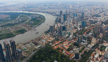 Top View of Building in a City - Aerial view Skyscrapers flying by drone of Ho Chi Mi City with development buildings, transportation, energy power infrastructure.