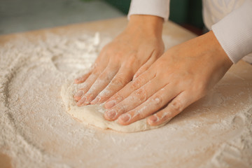Making dough by female hands at home