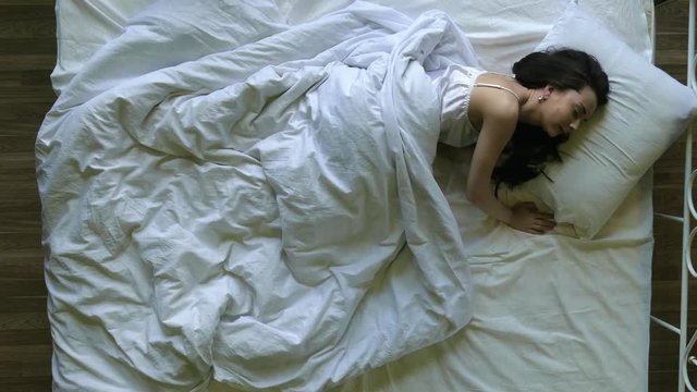 Beautiful woman in bed at home