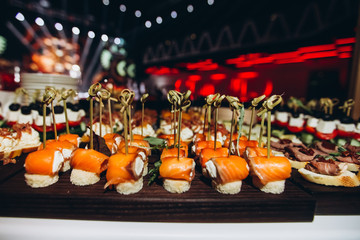 Variety assortment of different luxury food snacks and appetizers, concept of decorated catering banquet set, on a party event celebration