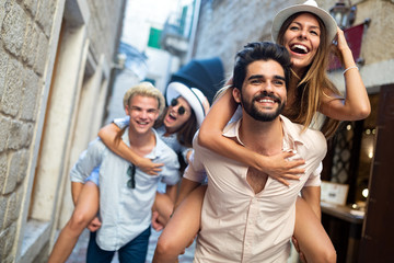 Group of young friends hangout on city street © NDABCREATIVITY