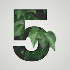 Nature concept. Creative number with green leaves on a gray background. Creative typography,...