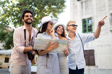 Happy group of tourists traveling and sightseeing together