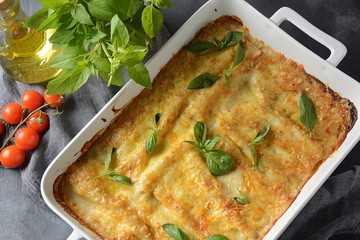 Cannelloni pasta stuffed with spinach, mushrooms,ricotta and sauce bechamel. Italian cuisine. Traditional food for Shavuot Jewish holiday