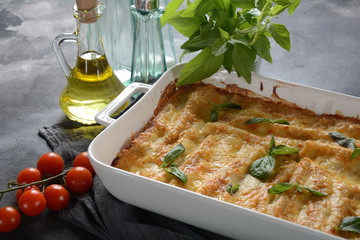 Cannelloni pasta stuffed with spinach, mushrooms,ricotta and sauce bechamel. Italian cuisine....