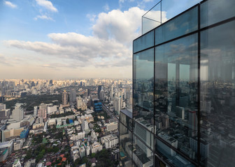 Fototapeta na wymiar Modern glass building with crowded downtown at bangkok city
