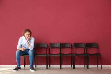 Young man waiting for job interview indoors