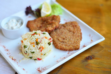 rice with vegetables with a piece of fish