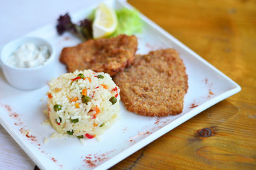 rice with vegetables with a piece of fish