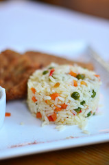 rice with vegetables with a piece of fish