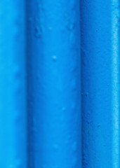 Many old blue pipes. Pipeline used in different industry ways: gas, water or vapor supply. Close up