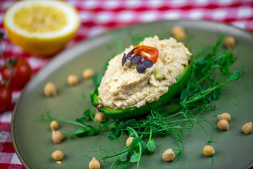 Avocado boats stuffed with hummus